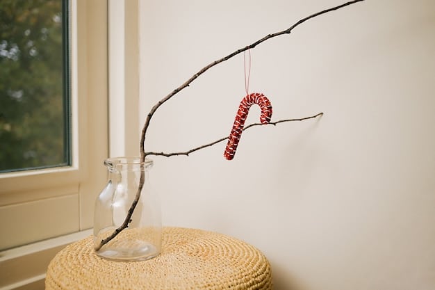 A collection of nature-inspired sculptures made by children using twigs, leaves, stones, and flowers. The sculptures are displayed on a wooden table in a brightly lit room.