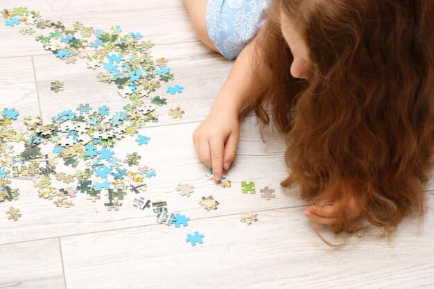 Close-up shot of a child's hands carefully placing a puzzle piece into a complex section of the jigsaw puzzle. Focus on the intricate details of the puzzle pieces and the child's focused expression.