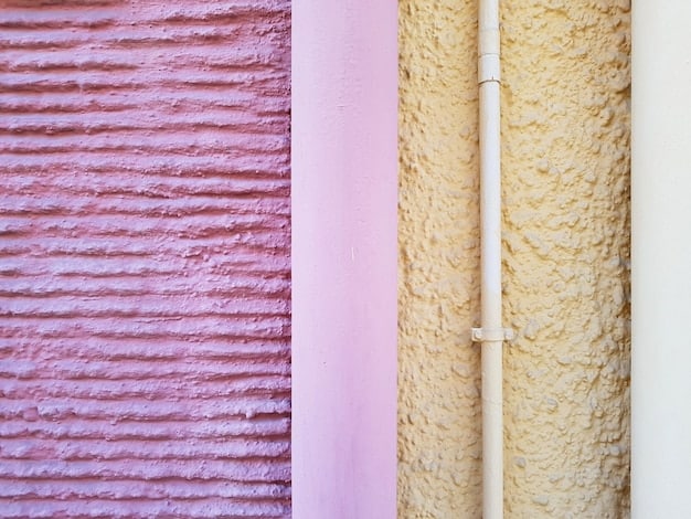 A close-up shot of a wall with various DIY soundproofing materials, such as mass-loaded vinyl, acoustic foam, and fiberglass insulation, highlighting their textures and application methods.