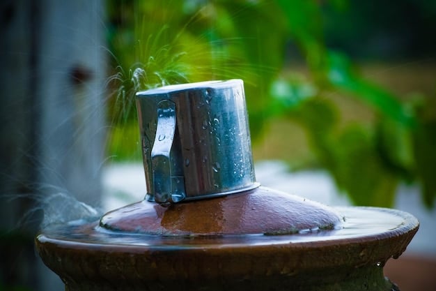 A close-up shot of a rain barrel spigot with collected rainwater flowing into a watering can, highlighting the ease of access and use.