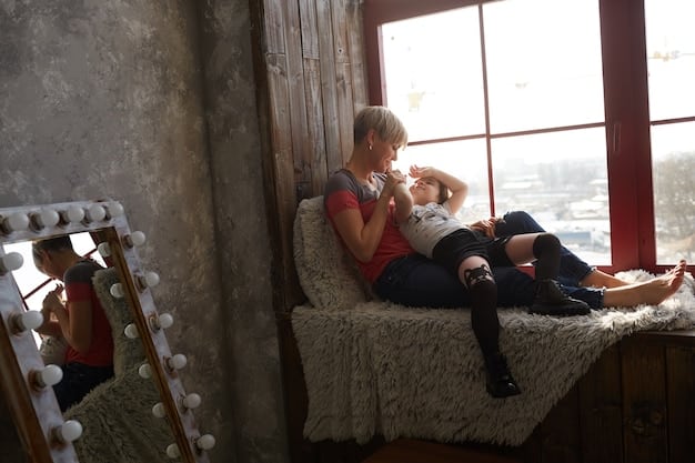 Two young siblings sitting together on a couch, one comforting the other with a gentle hug. The scene conveys a sense of empathy and mutual support between siblings in a brightly lit living room.