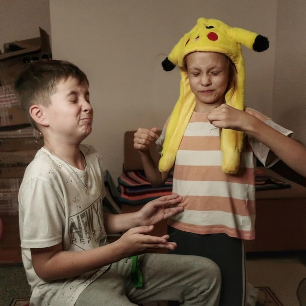Two children engaging in role-playing, with one child acting as a frustrated customer and the other as a calm and helpful store clerk. They are using simple props and showing clear emotional expressions to enhance the role-play.