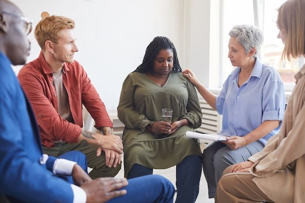 A diverse group of caregivers attending a support-group meeting. They are sitting in a circle, listening attentively and sharing their experiences. The setting is a brightly lit community center with comfortable seating and a supportive, empathetic atmosphere.