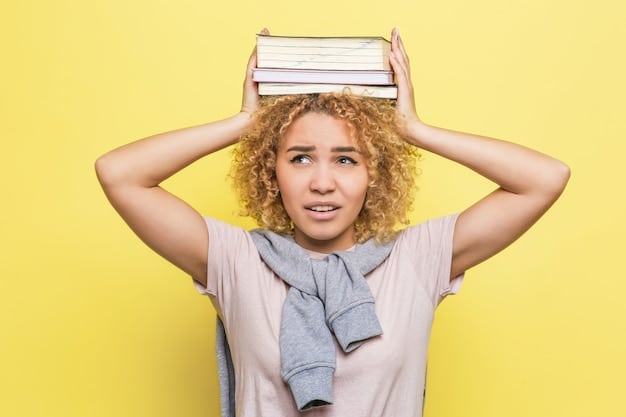 A teenager sitting hunched over a desk, surrounded by books, looking stressed and overwhelmed, with a hand on their forehead as if experiencing a headache.