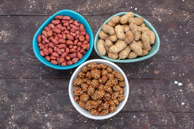 A close-up shot of various common allergens such as peanuts, a cat, pollen, and a container of milk, all arranged on a light-colored wooden surface. The image is well-lit and has a clear focus on each allergen.