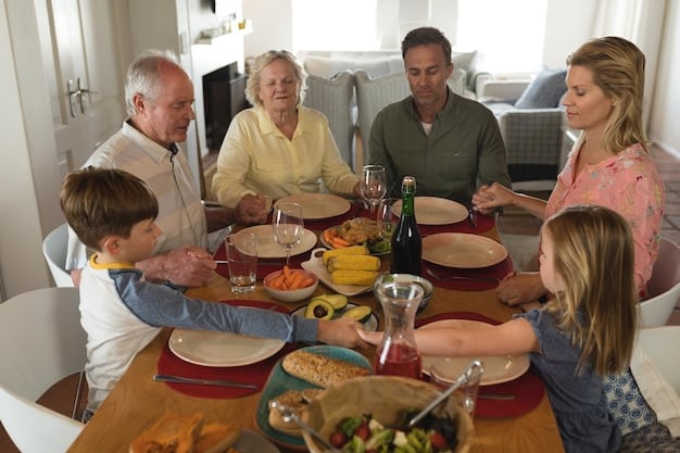 A multi-generational family, including grandparents, parents, and children, gathered around a large dining table, engaging in lively conversation and laughter during a family meal. The scene captures the warmth and connection of intergenerational bonding.