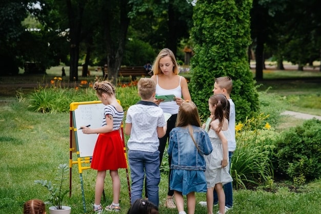 A teacher guiding a small group of children in an outdoor play area. The children are actively engaged in various activities, such as climbing, running, and interacting with natural elements like sand and water.