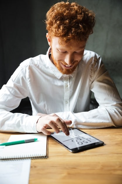 A person using a calculator and looking at a spreadsheet, focusing on budgeting. Beside them is a sign that reads, 