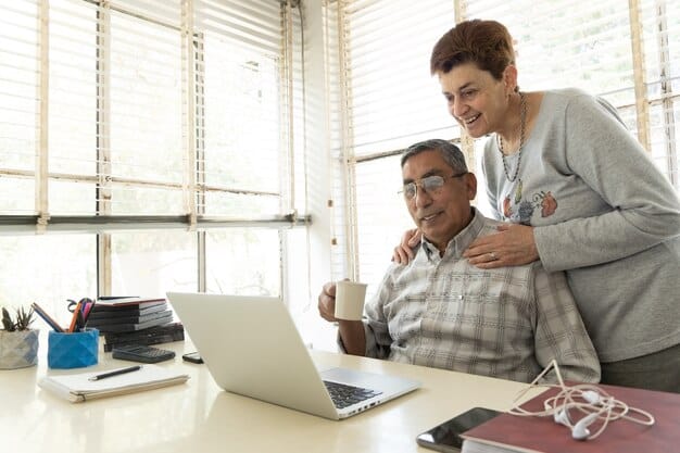 A cheerful scene of a support worker assisting an individual with special needs in a supported living apartment, working together on a laptop, illustrating financial management skills.