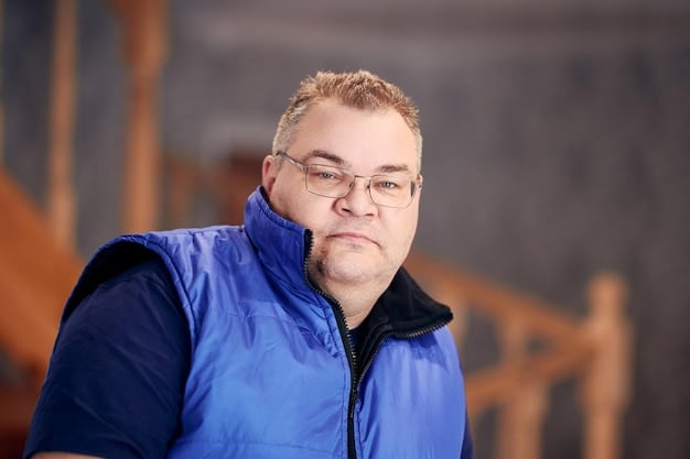 A young adult with Down syndrome is happily engaged in a vocational training program, learning job skills. The scene highlights the importance of planning for future independence and employment opportunities.