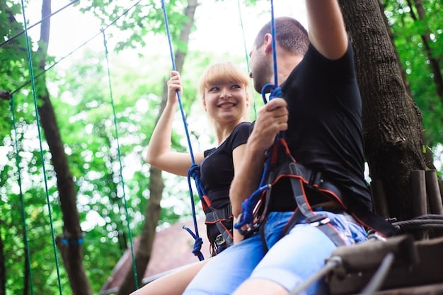 A counselor at a special needs summer camp helping a child zip-line, emphasizing safety and encouragement. The child looks excited and confident.